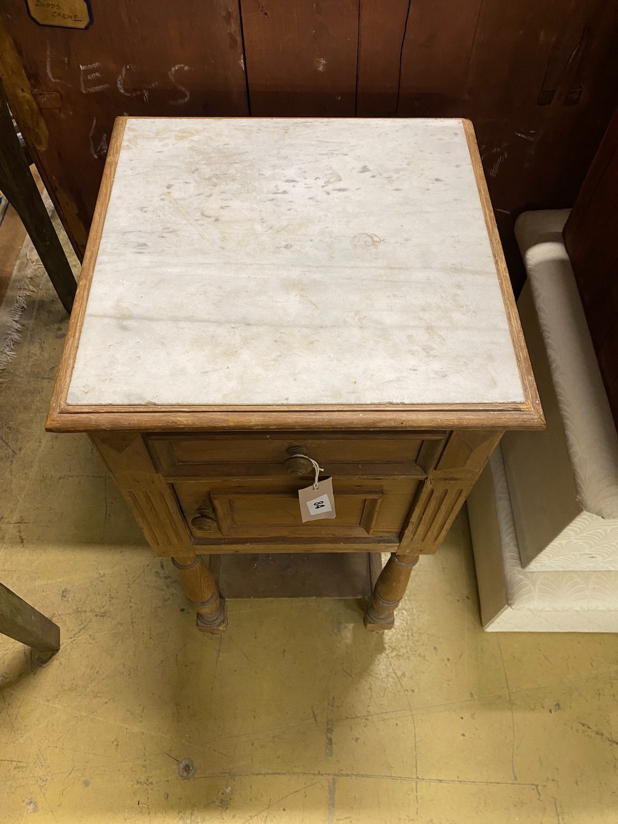 A late 19th century French pine marble topped two tier bedside cabinet, width 38cm, depth 38cm, height 88cm